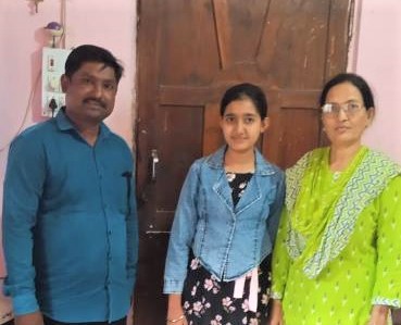 Student receiving scholarship certificate